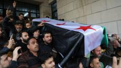 ‘I wish he’d lived to see new Syria’: Crowds bury anti-Assad activist