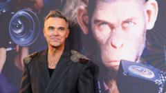 Robbie Williams explains why he’s a monkey in his new movie