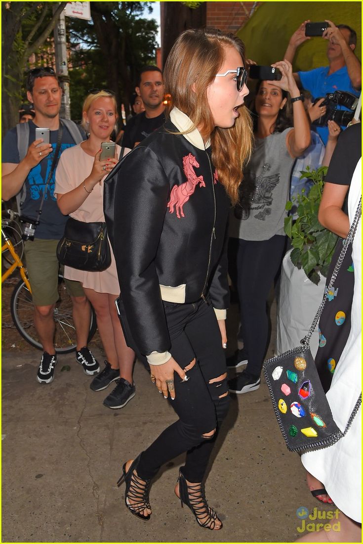 Cara Delevingne plays Elton John in Step Into Christmas video remake