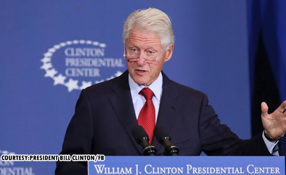 Bill Clinton is hospitalized with a fever but in good spirits, spokesperson says