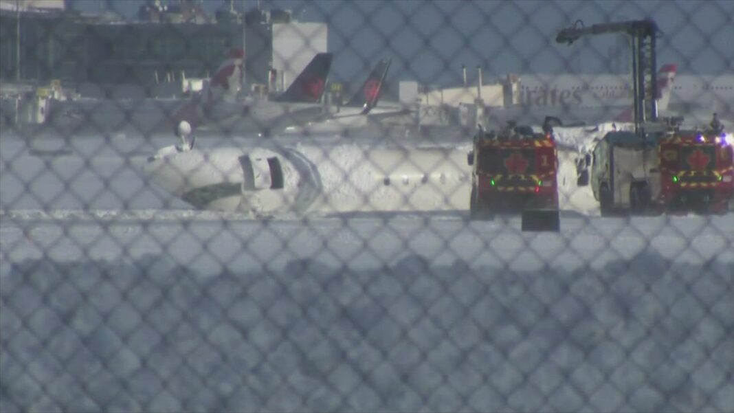 delta-jet-flips-upside-down-on-a-snowy-toronto-runway-and-all-80-aboard-survive