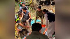 Four more men freed from flooded Laos cave after 10 days four-more-men-freed-from-flooded-laos-cave-after-10-days