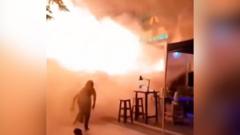 People flee Bangkok bar as huge flames shoot out from doorway people-flee-bangkok-bar-as-huge-flames-shoot-out-from-doorway